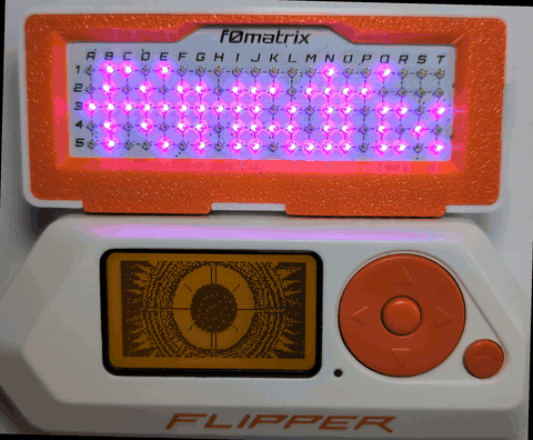 f0matrix running its title-card demo: 100 WS2812B LEDs cycling animated text